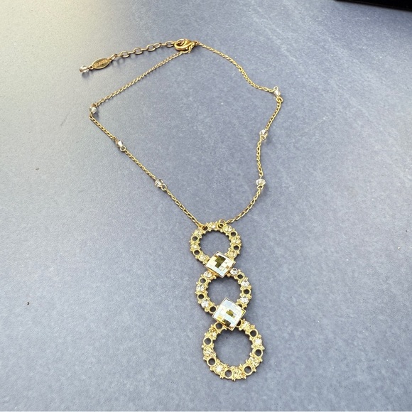 Belladonna Circular Crystal and Gold Tone Infinity Pendant Necklace - Picture 14 of 17